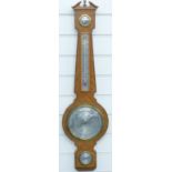 A 20thC aneroid barometer in Edwardian style by O Comitti & Son, silvered dial,