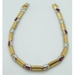 An 18ct bi-coloured gold tennis bracelet set with alternating rubies and diamonds, 17.