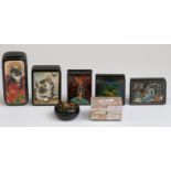 Six Russian lacquer boxes, some signed and a mother of pearl trinket box,