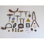 Collection of buckles including retro plastic examples, corkscrews, tokens from Cotswold Inn,