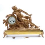 French 19thC gilt metal ormolu style figural mantel clock featuring a reclining lady with cherub