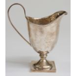 Hallmarked silver helmet shaped pedestal cream jug, Birmingham but date rubbed, maker Henry Moreton,