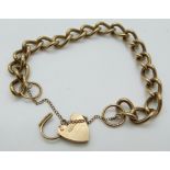 A 9ct gold curb link bracelet with a 9ct gold heart padlock clasp, 23.