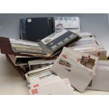 A large quantity of matching GB first day covers and presentation packs,