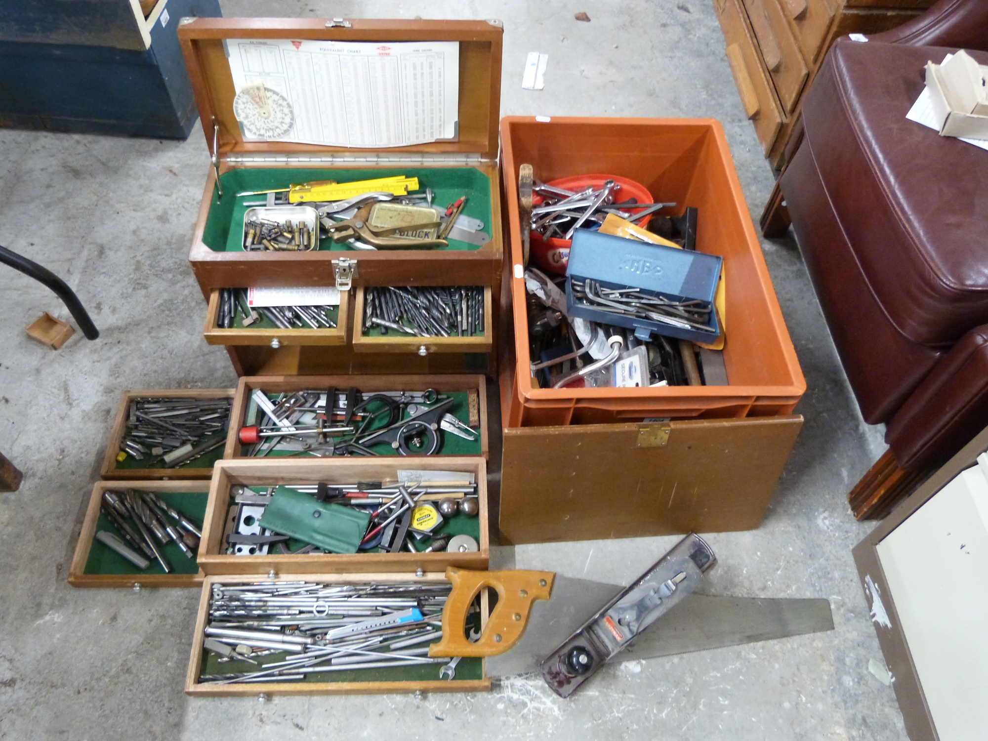 An engineer's tool chest and tools to include drills, bits, clamps, steel rods,