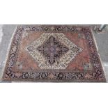 Kashkuli style carpet with all over multi-coloured decoration and fringed ends on navy blue ground,