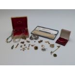A collection of costume jewellery including rolled gold bangle, earrings, brooches etc