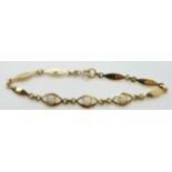 An 18ct gold bracelet set with opals, 5.5g