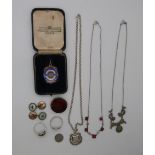 A collection of silver including a fob, another darts fobs, brooch set with agate, marcasite