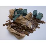 A large quantity of UK copper and brass coinage pennies, halfpennies and threepenny bits,