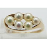 A 9ct gold ring set with pearls, size Q