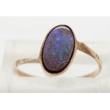 A 9ct gold ring set with an opal triplet, size L