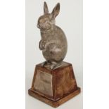 Modern hallmarked silver novelty rabbit on square tapering wooden base, London 1981 maker's mark
