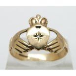 A 9ct gold Claddagh ring set with a diamond , 2.7g, size R