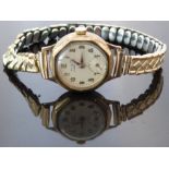 H & G 9ct gold ladies wristwatch with inset subsidiary seconds dial, gold hands and Arabic numerals,