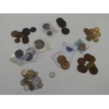 A small interesting collection of UK and overseas coinage, small silver content including a