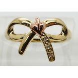Clogau 9ct gold ring in the form of a bow set with diamonds, in original box, size L