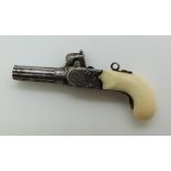 A 19thC miniature pistol with turned and chased barrel and ivory grip, the working hammer action