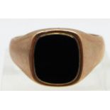 A 9ct gold ring set with onyx, marked Bravingtons, 6.6g, size W
