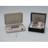 A suite of Belacci jewellery comprising watch, earrings, necklace and a watch