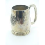 Eastern white metal pint tankard with embossed circular plaque of a deity, marked to base Thailand