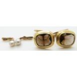 A pair of yellow metal cufflinks set with smoky quartz and pearl studs