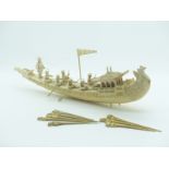 Late 19th/20thC carved ivory and bone boat with figures etc, length 28cm, together with eight carved