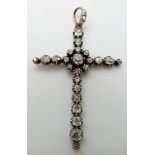 Georgian cross pendant set with old mine cut diamonds in a silver setting, the largest diamond