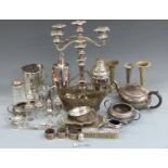 A quantity of silver plate including candelabra, cocktail shakers, teapot, hallmarked silver pepper,