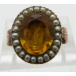 Victorian ring set with a citrine in a foiled mount surrounded by seed pearls, size M