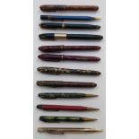 Twelve various fountain and ballpoint pens and propelling pencils including Waterman's 877,
