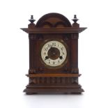 C1900 Carved Mahogany cased mantle clock, the ivory coloured Arabic chapter ring with beetle and