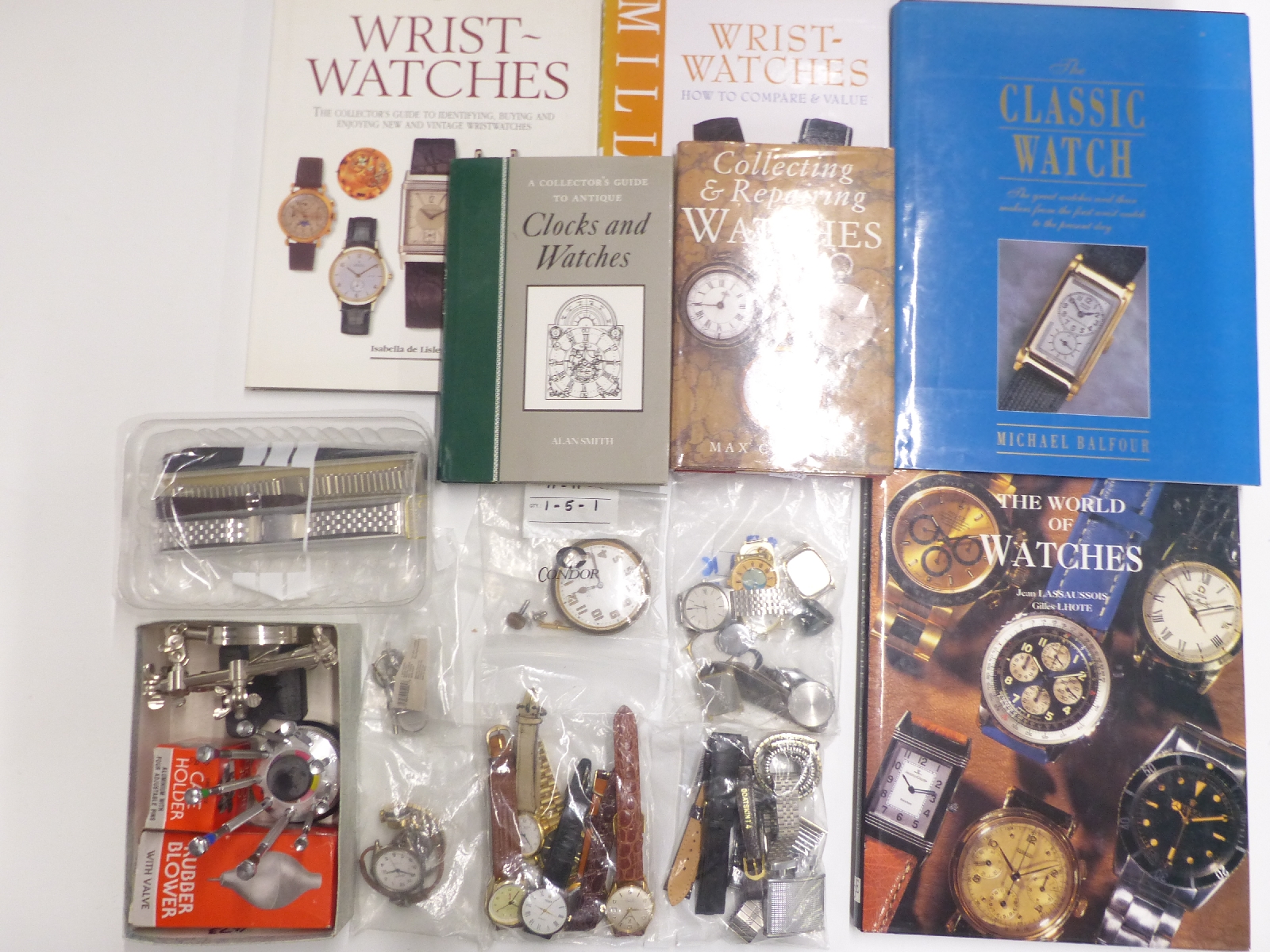 A collection of watches, watch repair tools and watch books including The Classic Watch,