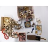 A collection of jewellery including brooches, beaded necklaces, compacts including Art Deco combined