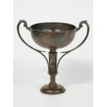 George V hallmarked silver twin handled trophy cup with tapering hexagonal stem, engraved