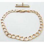 A 9ct gold curb link bracelet and a 9ct gold brooch, 9g