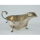 George V hallmarked silver sauce boat raised on three feet, Birmingham 1928 maker Kirwan & Co Ltd,