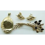 A 9ct gold locket, 9ct gold brooch set with sapphires and a pair of 9ct gold earrings, 6.7g