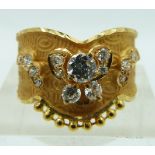 A yellow metal Indian ring set with cubic zirconia, 3.2g, size R