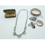 A silver bangle, silver brooches, two cased studs and a diamanté necklace