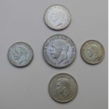 1935 George V 'rocking horse' crown, F+ together with a 1928 florin and three George VI coins,