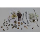 A collection of costume jewellery including a pair of yellow metal earrings, a silver fob chain,