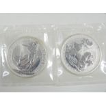 1998 one ounce silver Britannia and a 1999 example