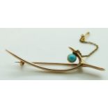 A 15ct gold brooch in the form of a wishbone set with turquoise, 3.75g