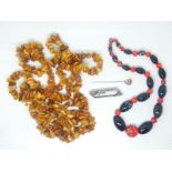 A glass beaded necklace, Art Deco paste brooch and an amber necklace