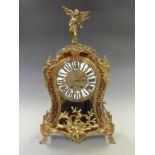 Louis style mantel clock, the brass dial with cabouchon Roman numerals, Brequet style hands, the