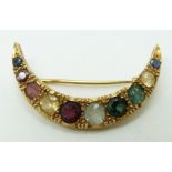 Victorian / Edwardian half crescent brooch set with beryl, two tourmalines, aquamarine, garnet,