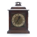 C1930 burr walnut mantel clock with silver Roman chapter ring, masked spandrels and filigree
