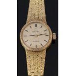 Omega 18ct gold ladies wristwatch ref. 7247 with black hands and baton markers, gold dial and signed