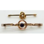 Two Edwardian 9ct gold brooches, one a knot set with a pearl and the other set with an amethyst, 4.